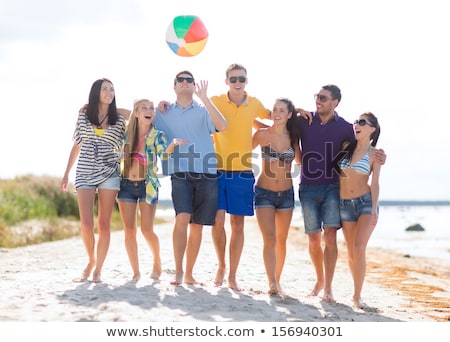 Foto stock: Smiling Teenage Girl In Sunglasses With Beach Ball