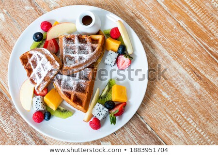 Foto stock: Waffle With Kiwi Fruit And Syrup