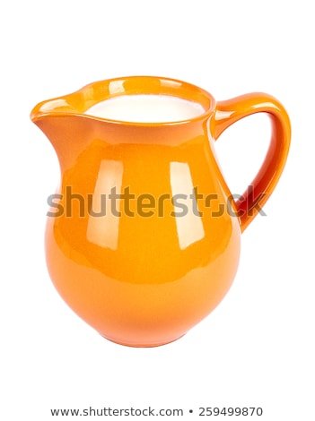 Foto d'archivio: Clay Jug With Milk