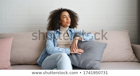 Stok fotoğraf: Attractive Black Young Woman Relaxing On The Livingroom