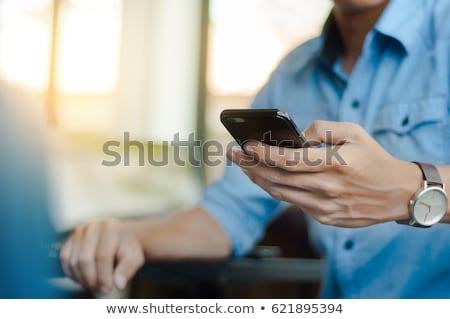 Stok fotoğraf: Happy Asian Man Talking On Mobile Phone