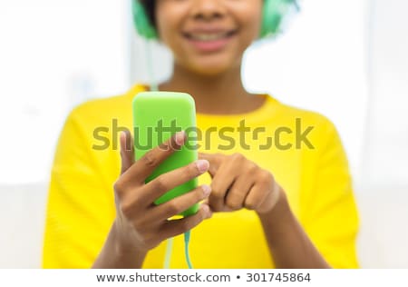 Stock fotó: Close Up Of Girl With Smartphone And Headphones