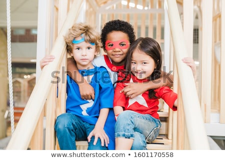 Stock photo: Group Of Affectionate Little Friends Of Various Ethnicities Sitting On Staircase