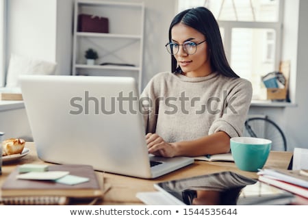 Foto d'archivio: Woman Working On A Laptop