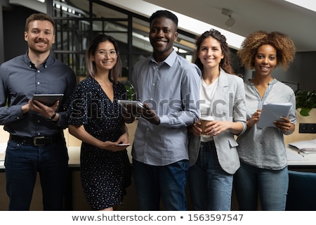 Stock photo: Young Asian Female Corporate Executives Working Together In Offi