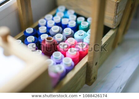 Stockfoto: Stack Of Coloured Sewing Thread