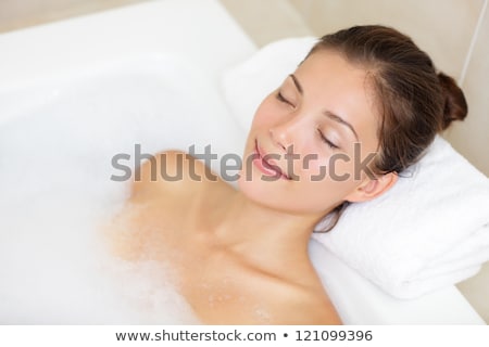Smiling Woman Relaxing In A Bath Stock fotó © Ariwasabi