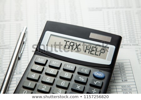 Stock fotó: Calculator With The Word Taxes On The Display