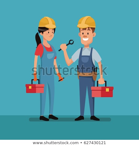 Stock photo: Female Construction Worker In A Helmet With A Perforator