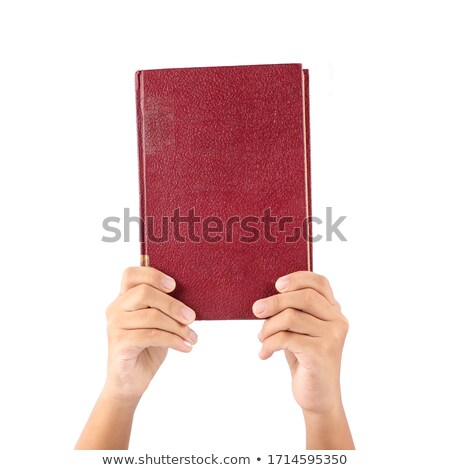 Stock photo: Hand Holds An Old Book