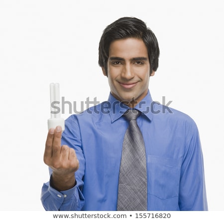 Foto stock: Indian Businessman Holding Idea Light Bulb