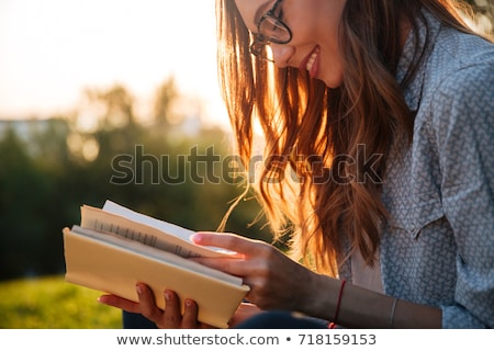 Stock fotó: Young Happy Brunette Woman With Book