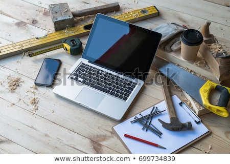 Stok fotoğraf: Carpenters With Ruler And Coffee At Workshop