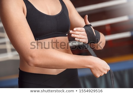 Foto stock: Pretty Woman With Sports Taping On The Body