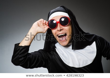 Foto d'archivio: Male Nun In Funny Religious Concept
