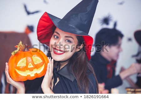 Stockfoto: Smiling Witch Woman Wearing Black Costume And Halloween Makeup L