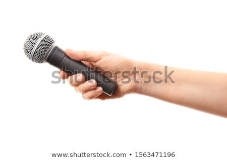 Stok fotoğraf: Female Hand Holding A Microphone