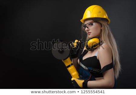 Stock photo: Female Construction Worker In A Hard Hat With Angle Grinder