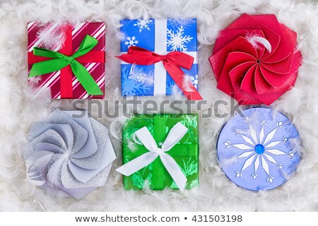 Сток-фото: Six Christmas Gift Packages Surrounded By Feathers