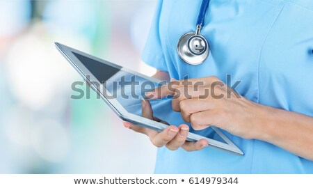 Stok fotoğraf: Doctor Reading Data On Computer Screen