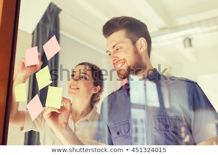 Stok fotoğraf: Happy Creative Team At Office Glass Board