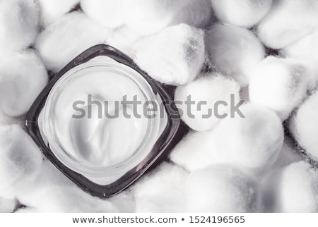 Stock photo: Luxury Face Cream For Sensitive Skin And White Cotton Balls On B