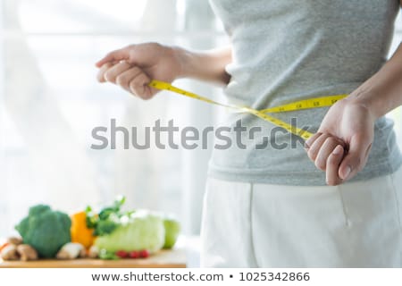 Stok fotoğraf: Fit Young Girl Checking Her Weight