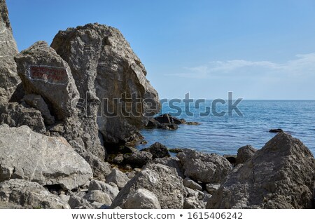 Foto stock: Landscape With Boulders And Rocks On Coast With Blue Sea