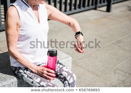 Stock photo: Woman With Fitness Tracker Doing Sports Outdoors