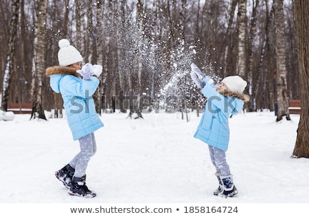 Stockfoto: Cute Girl With Snowflakes Having A Good Time