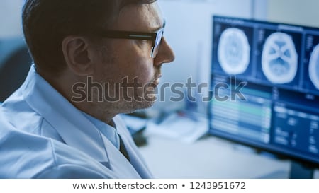 Stock fotó: Doctor Looking At Brain Mri