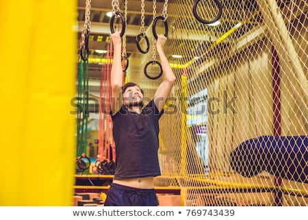 Stockfoto: The Man Passes The Obstacle Course In The Sports Club