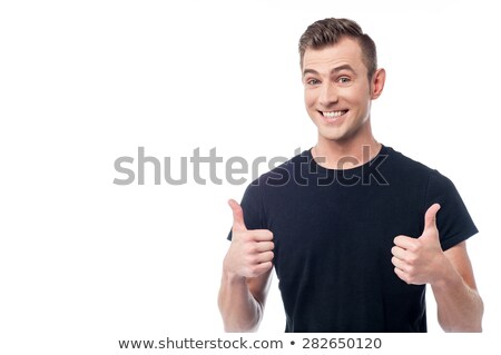 Stock photo: Cheerful Young Man Showing Double Thumbs Up