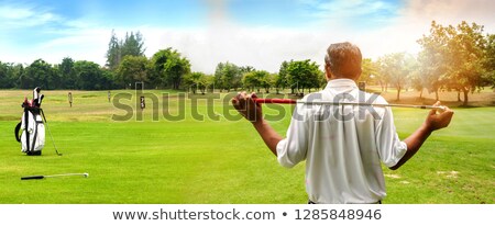 Foto stock: Beautiful Golfing Scenery With A Golfer Holding A Club