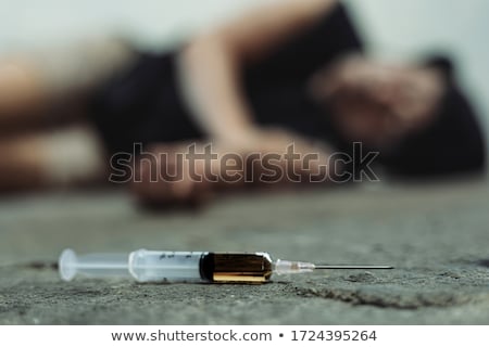 Foto d'archivio: Drug Addicted Person With Syringe