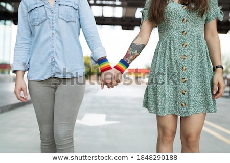 Stock photo: Couple With Gay Pride Rainbow Wristbands