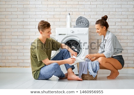 Stockfoto: Loving Couple Is Doing Laundry