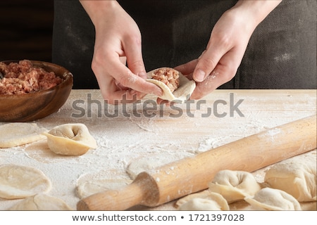 Foto stock: Female Hand With Wooden Rolling Pin