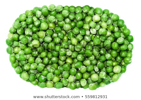 商業照片: Border Of Fresh Frozen Green Peas With Hoarfrost Closeup On White Background