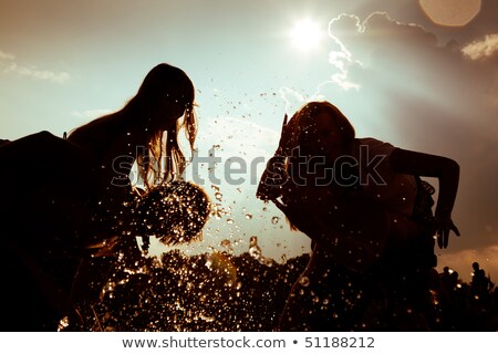 Four Friends Standing By A Lake Foto stock © Kzenon