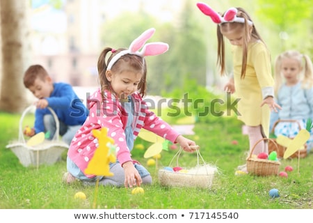 Stok fotoğraf: Little Girl Playing With Easter Eggs