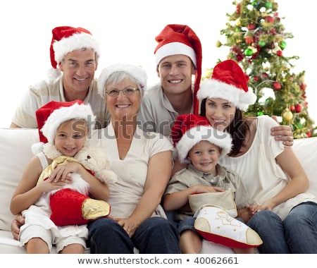 Foto stock: Children Sitting With Their Family Holding Christmas Boots