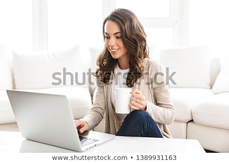 Сток-фото: Relaxed Young Woman At Home Working On Laptop Computer