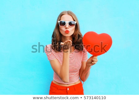 Foto stock: Cute Young Woman Sending Air Kiss