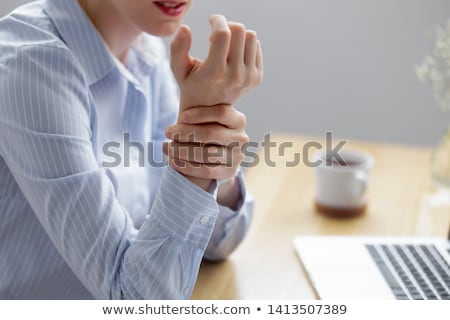 Foto d'archivio: Close Up Of Businesswoman Using Computer Mouse