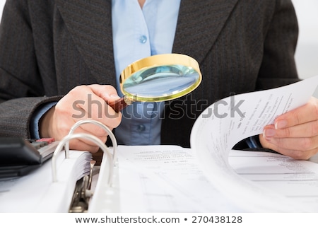 [[stock_photo]]: Auditor Investigating Business Fraud