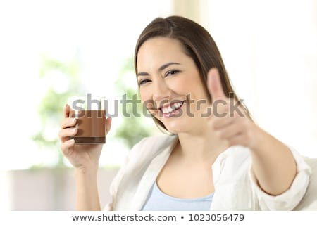 Stockfoto: Smiling Woman Offering Chocolates Looking At The Camera