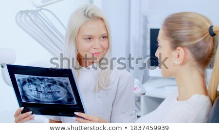 Stock foto: Doctor Explaining Situation To Patient In Hospital Office