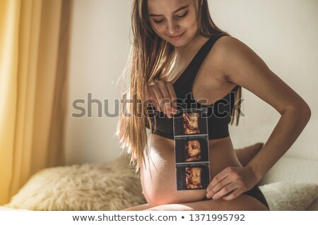 Stock fotó: Cropped Image Of Pregnant Woman Holding Ultrasound Scan