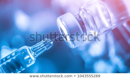 Stok fotoğraf: Medical Syringe And Vials